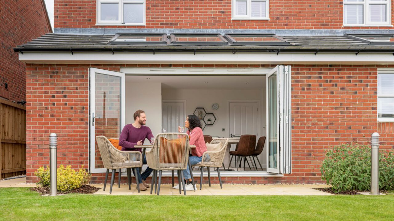 Morris-Couple-sat-at-patio-table-4-1-1536x1025