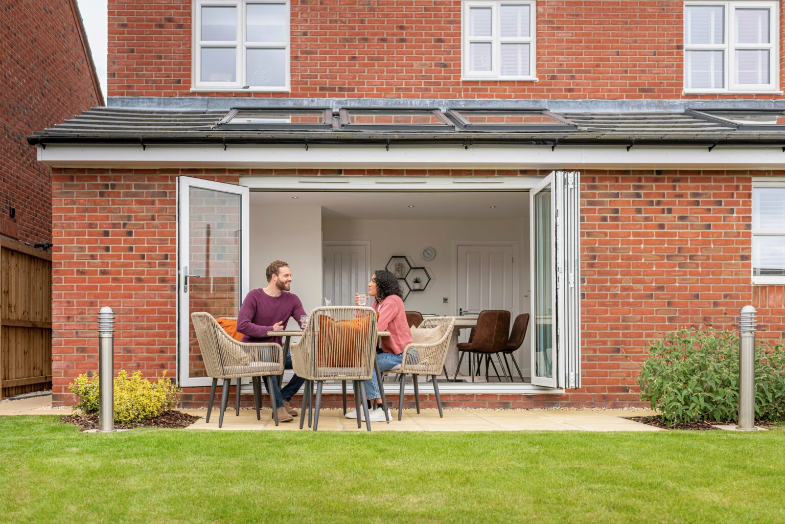 Morris-Couple-sat-at-patio-table-4-1-1536x1025